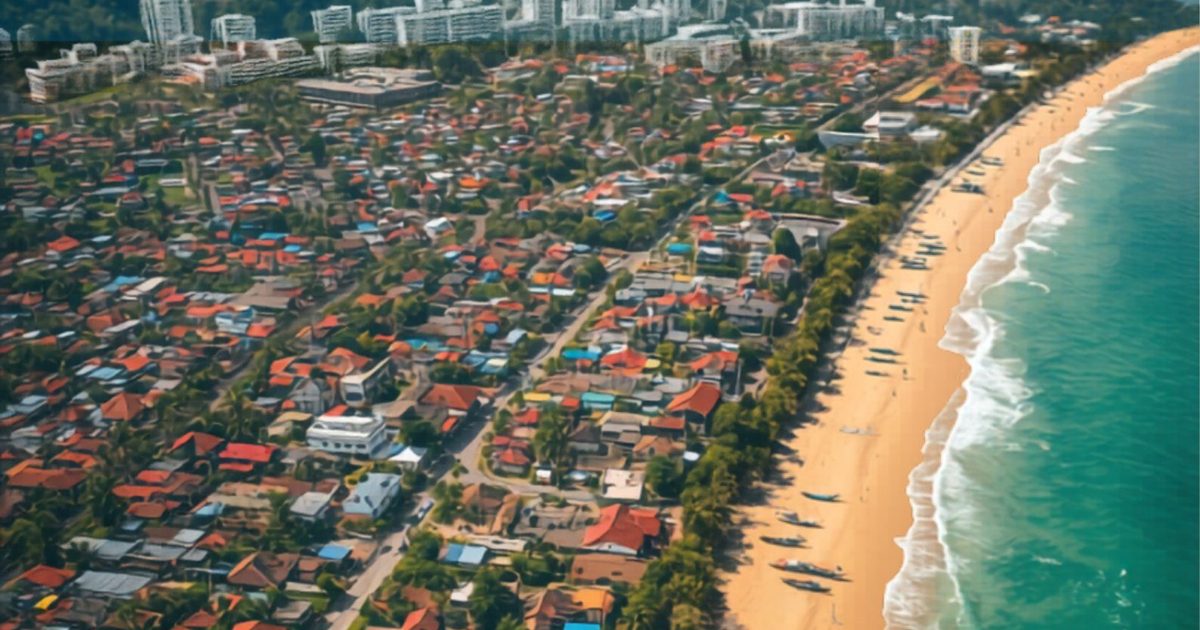 Aerial view of Phu Quoc coastal town with beach and mountains